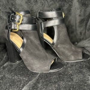 Black peep toe bootie with gold double buckle detail, worn twice
